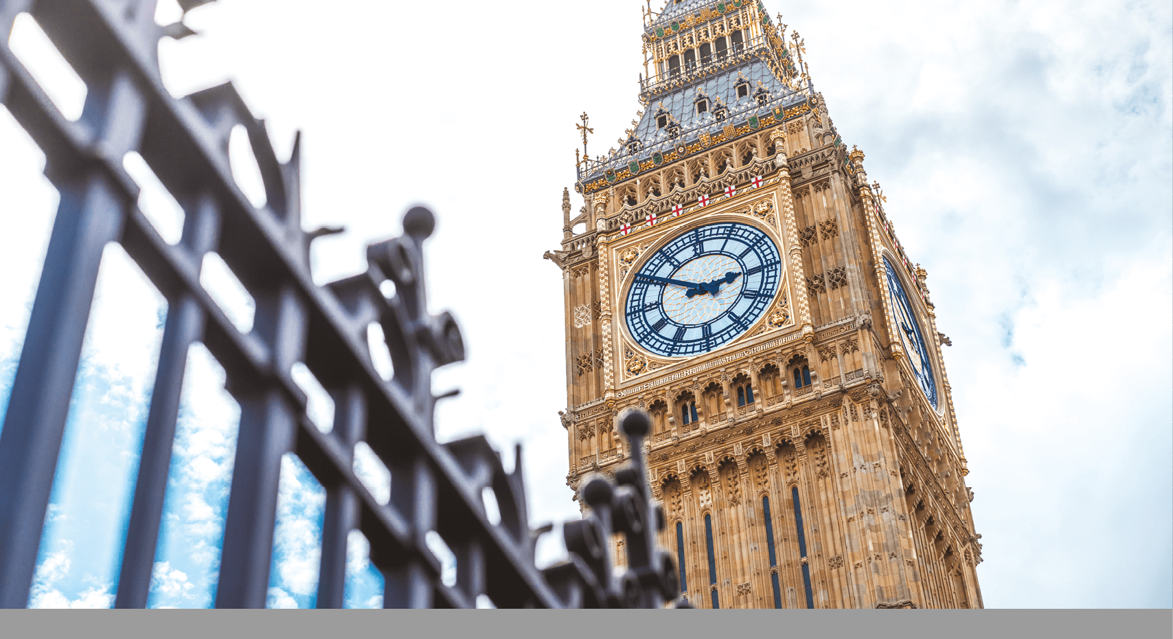 A large clock tower with a gold top. Description generated by AI