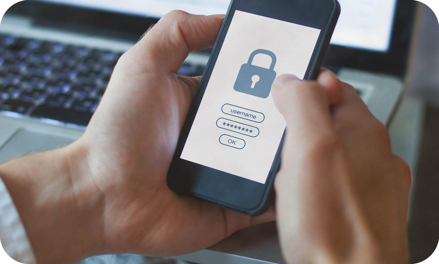 A person is holding a cell phone with a lock on the screen. Description generated by AI