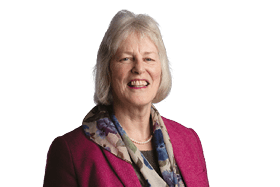 A woman wearing a pink jacket and a scarf. Description generated by AI