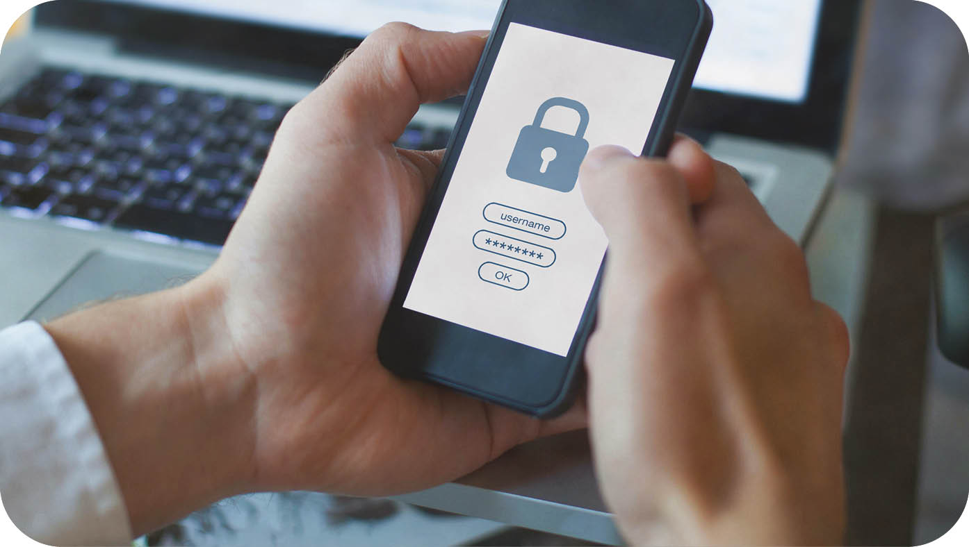 A person is holding a cell phone with a lock on the screen. Description generated by AI