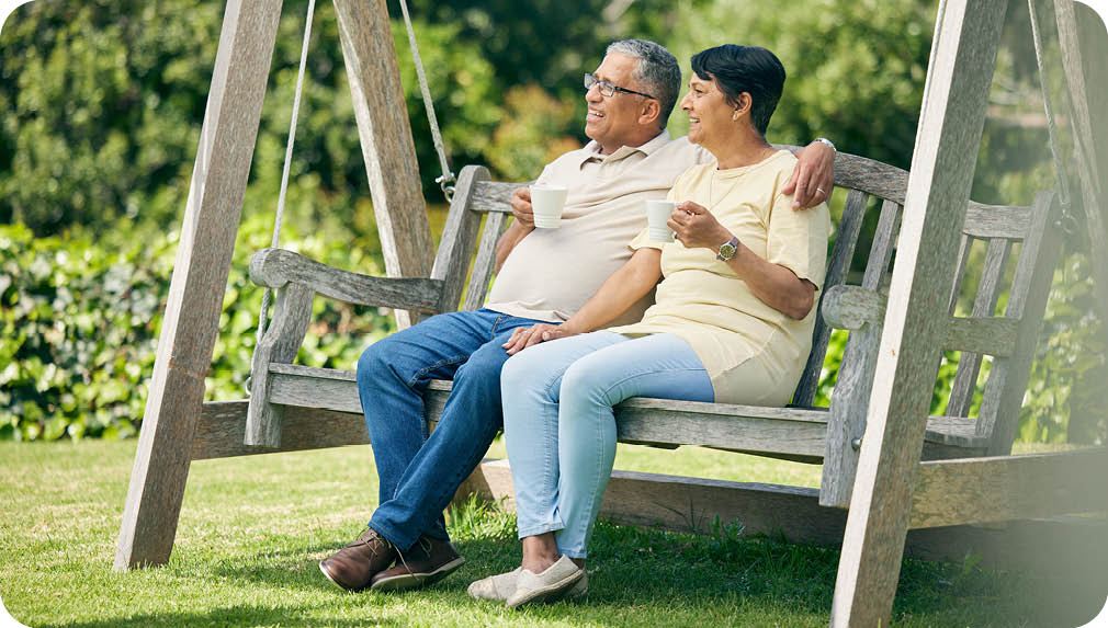 Tea, bench or old couple in park or nature talking and bonding together in retirement on holiday date. Senior, elderly man or mature woman drinking coffee to relax with love, peace or care in garden