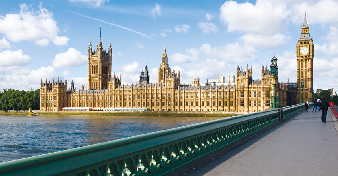The Palace of westminster, also known as the Houses of parliament in London UK, with westminster bridge in the foreground.