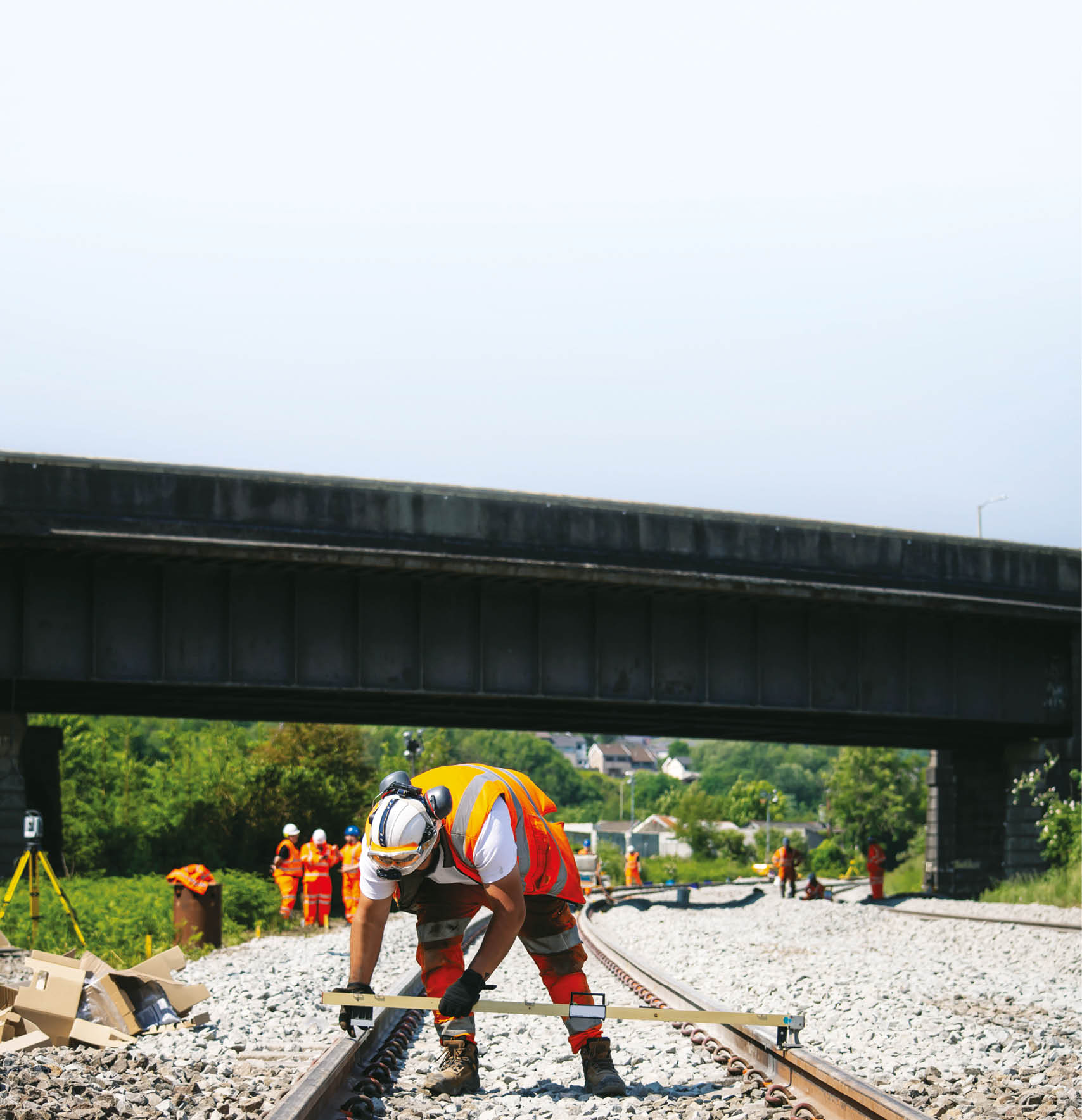 A man is working on a railroad track. Description generated by AI