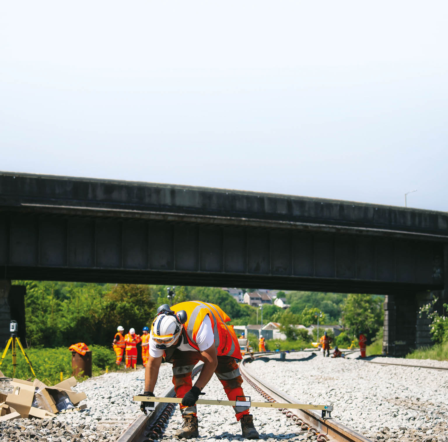 A man is working on a railroad track. Description generated by AI