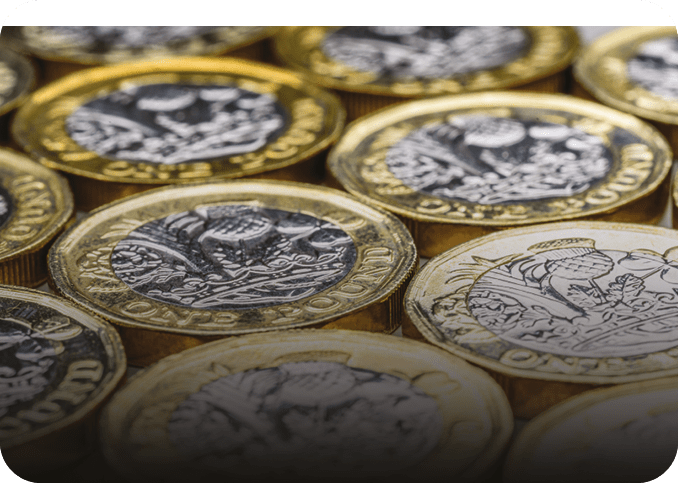 A stack of gold and silver coins. Description generated by AI