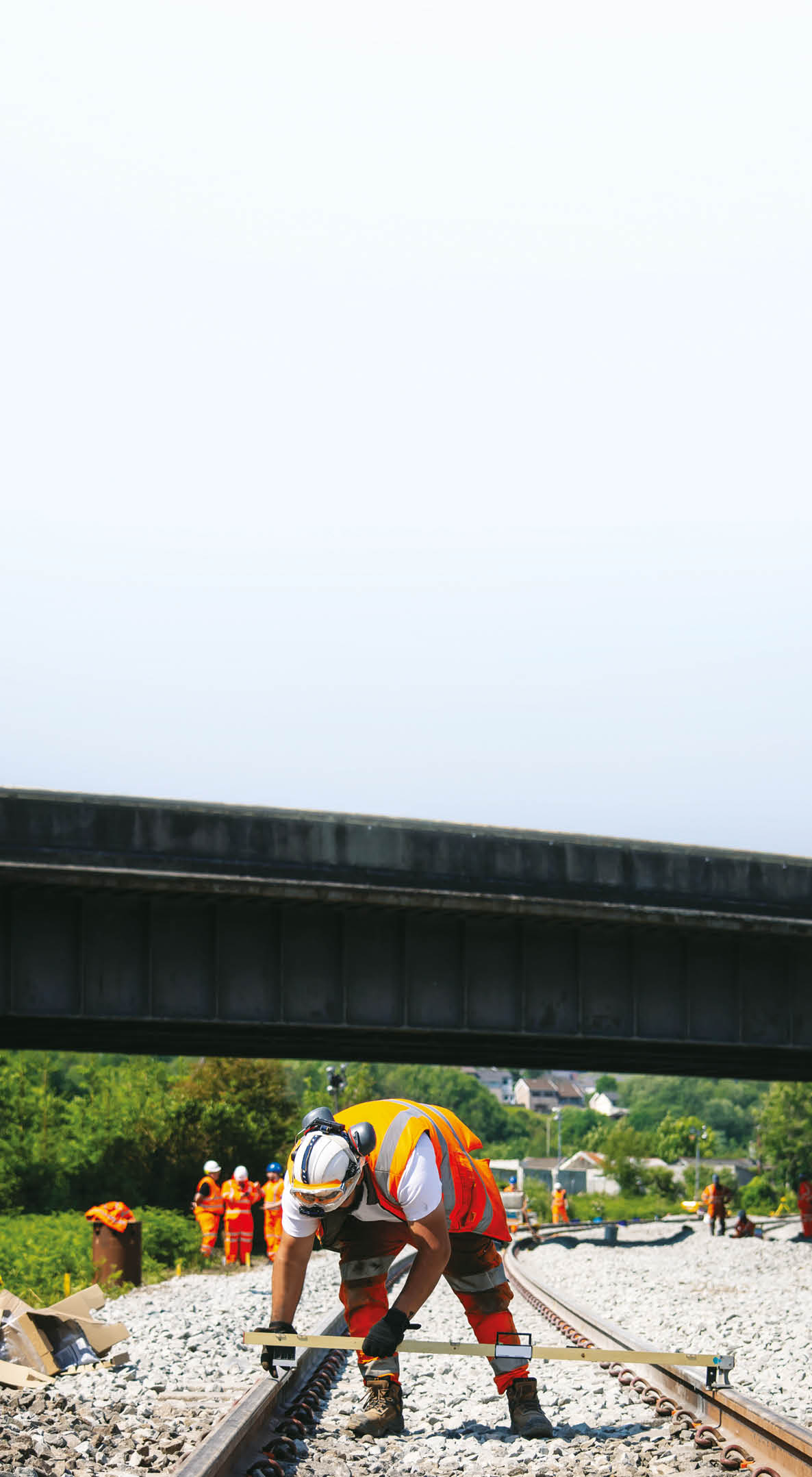 A man is working on a railroad track. Description generated by AI