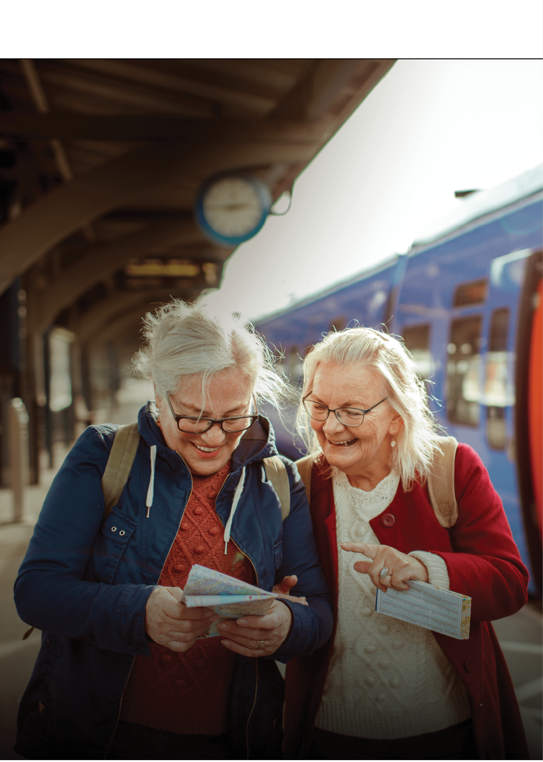Close up of two seniors at a train station