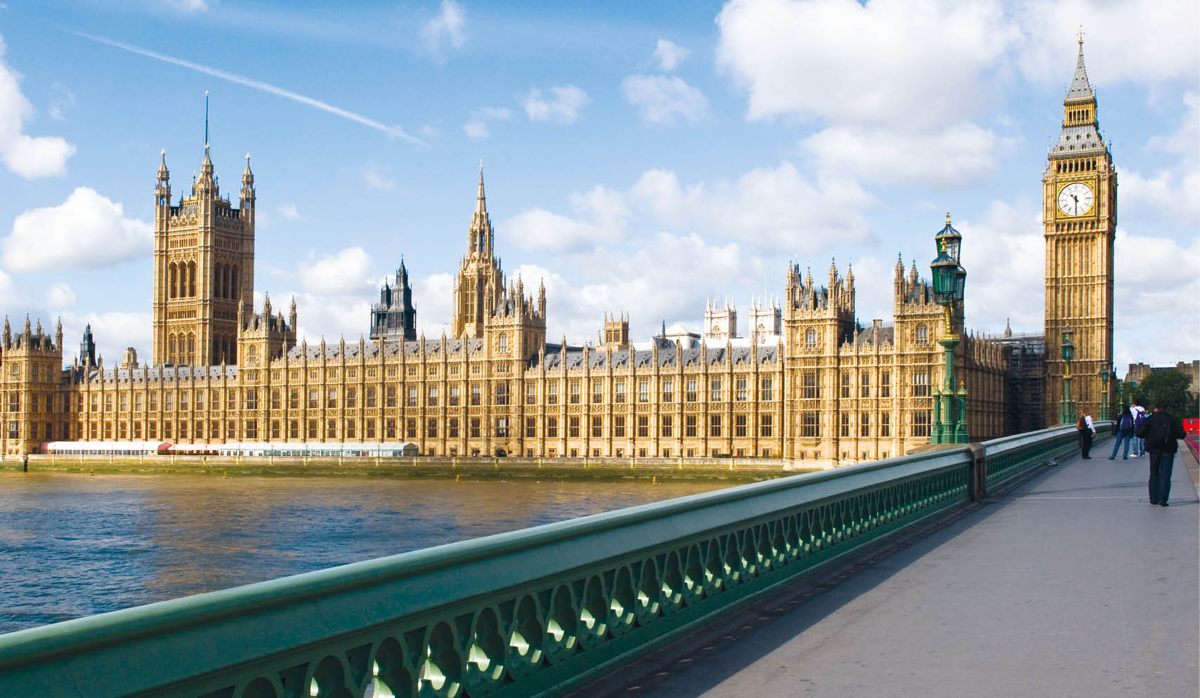 The Palace of westminster, also known as the Houses of parliament in London UK, with westminster bridge in the foreground.