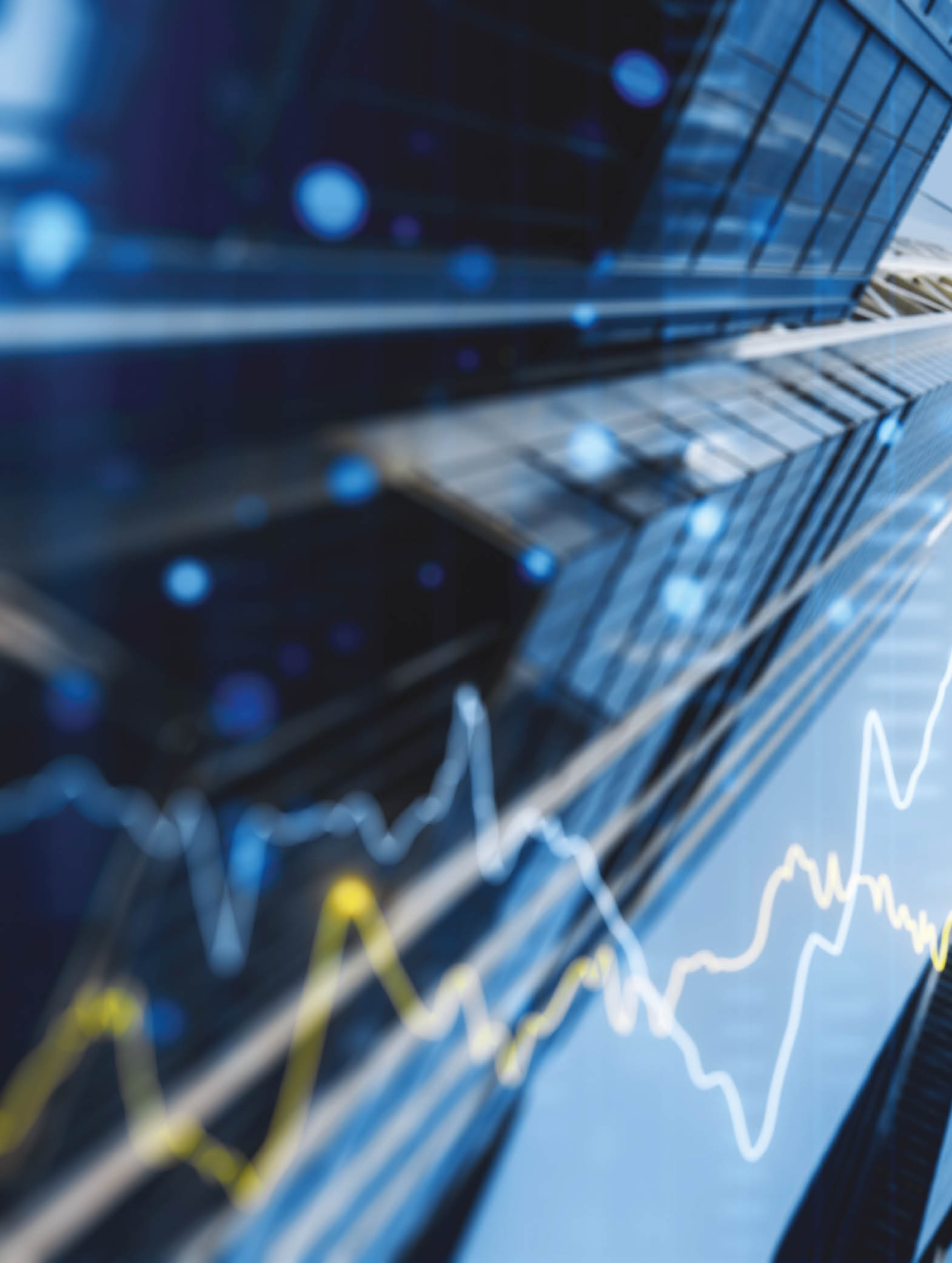 A double exposure image of skyscrapers with overlay of financial graphs, set against a blurred background, illustrating the concept of business growth