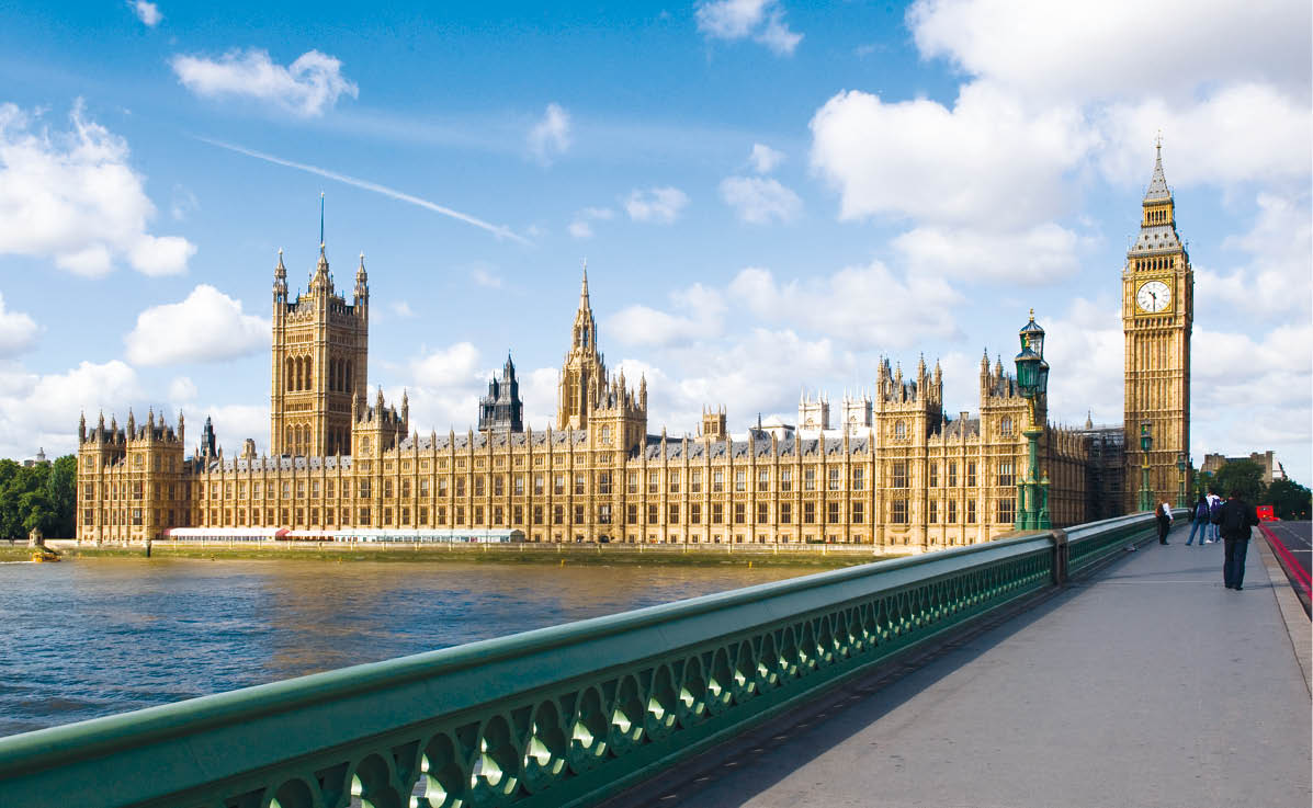 The Palace of westminster, also known as the Houses of parliament in London UK, with westminster bridge in the foreground.