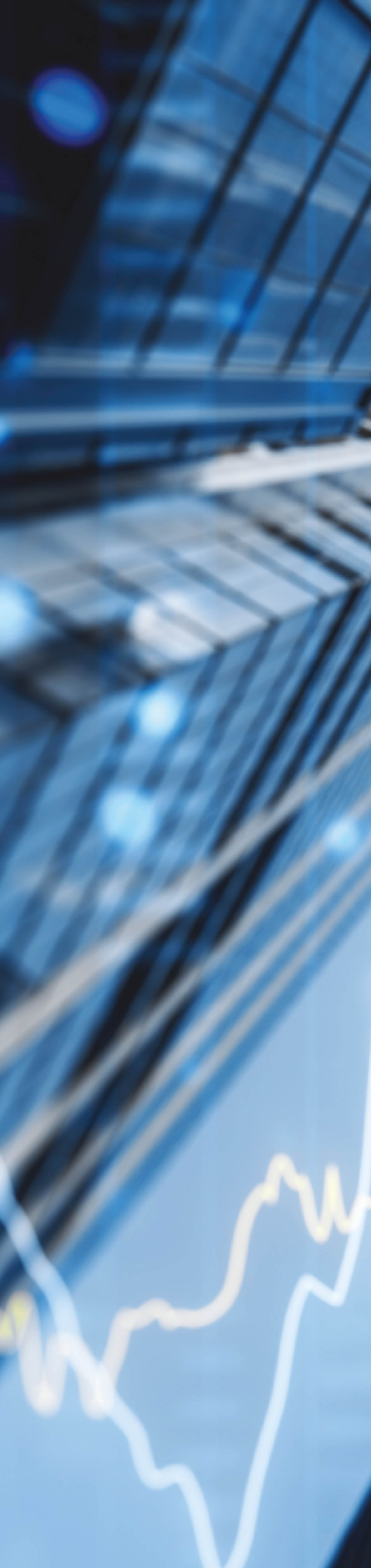 A double exposure image of skyscrapers with overlay of financial graphs, set against a blurred background, illustrating the concept of business growth