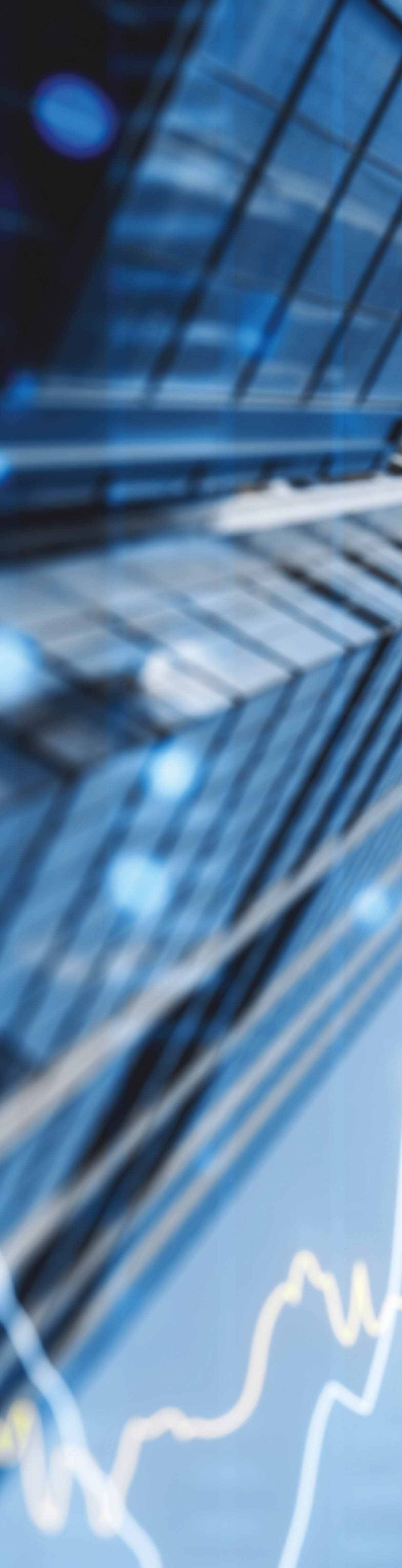 A double exposure image of skyscrapers with overlay of financial graphs, set against a blurred background, illustrating the concept of business growth