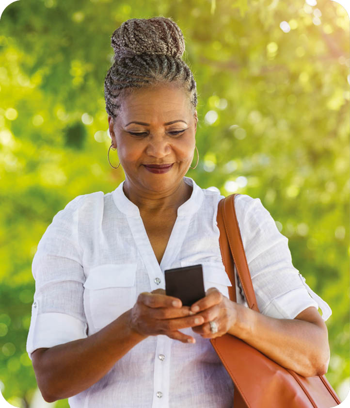 A woman in a white shirt is looking at her cell phone. AI generated content