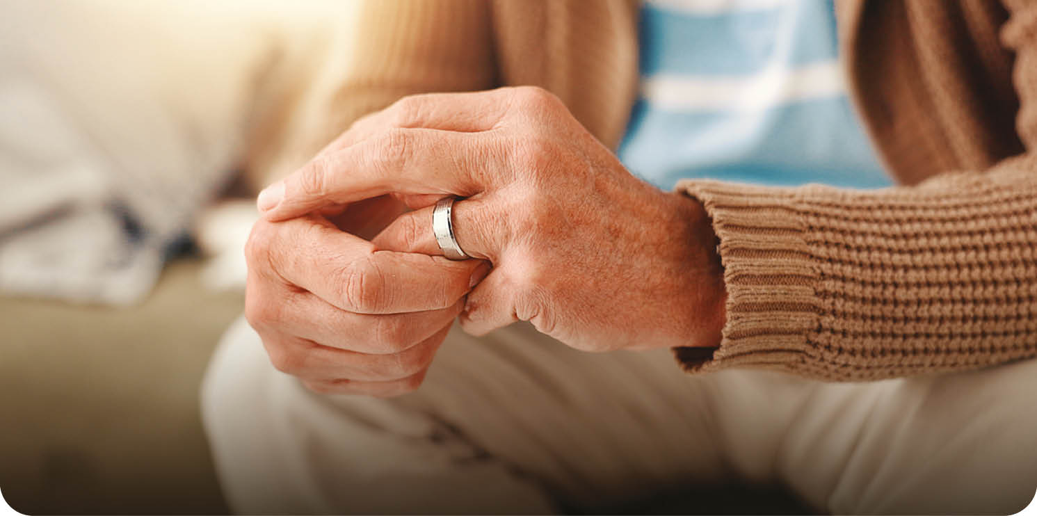 A man wearing a ring is sitting on a couch. AI generated content