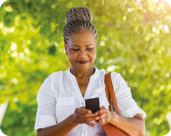 A woman in a white shirt is looking at her cell phone. AI generated content