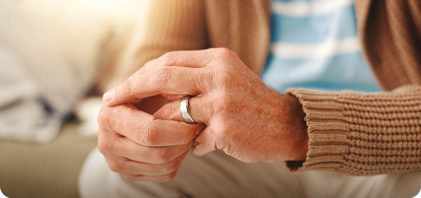 A man wearing a ring is sitting on a couch. AI generated content