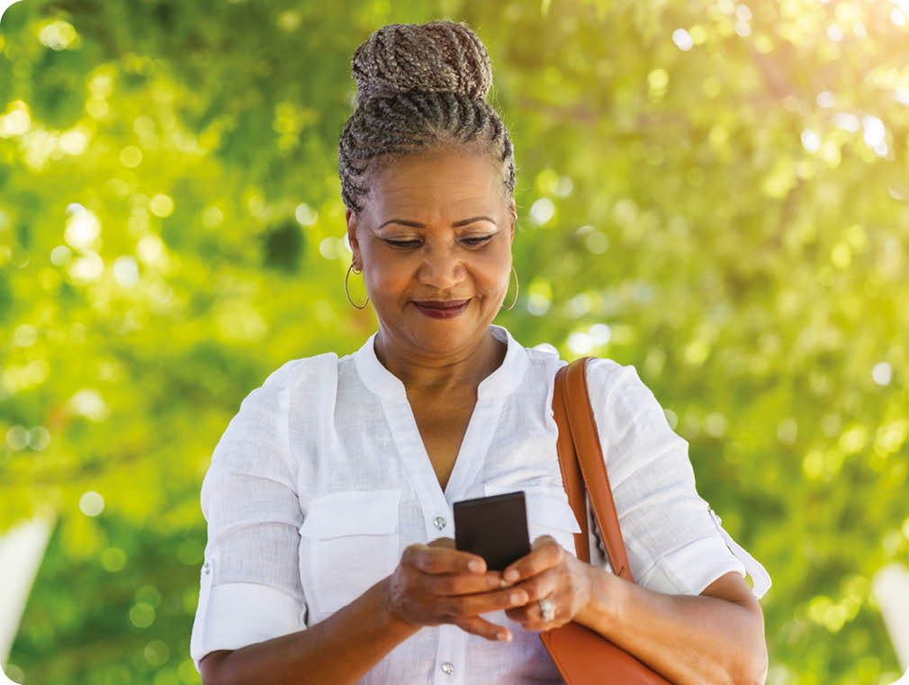 A woman in a white shirt is looking at her cell phone. AI generated content