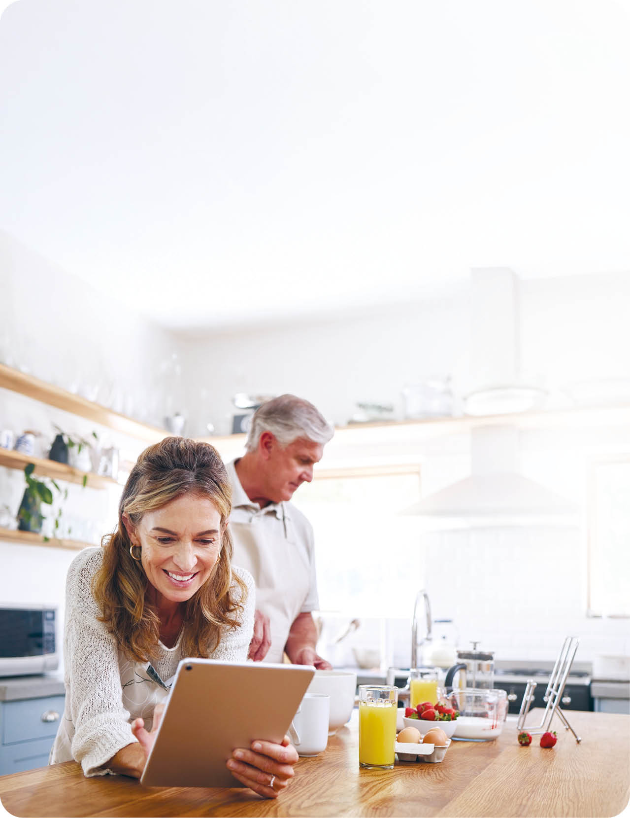 Woman, tablet and old couple in home kitchen on social media, internet surfing or reading news. Retirement, elderly husband and wife in house with 5g mobile and streaming web content on digital tech.