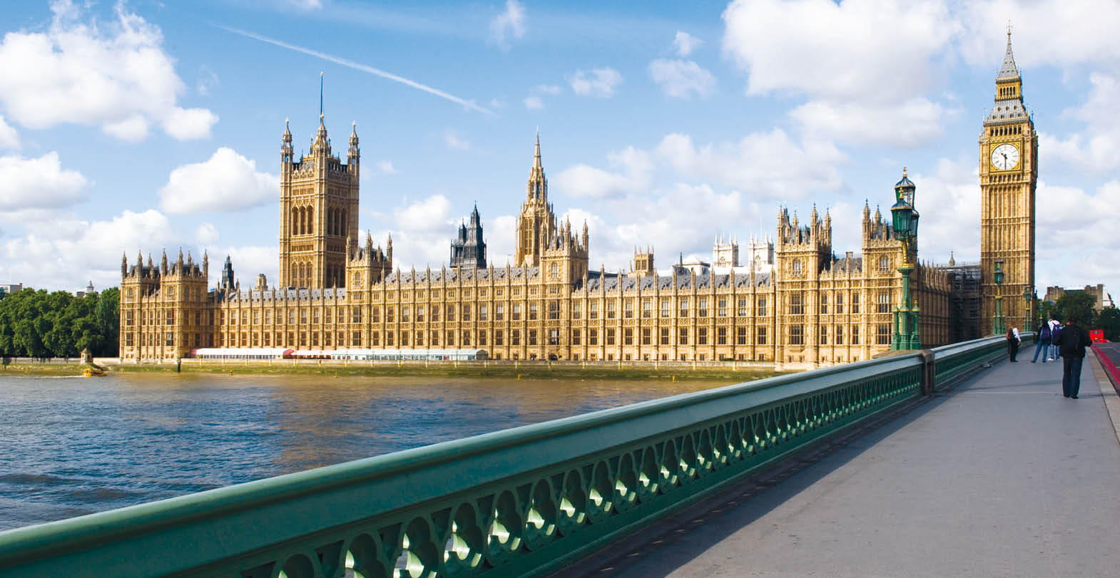 The Palace of westminster, also known as the Houses of parliament in London UK, with westminster bridge in the foreground.