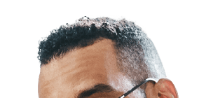 Shot of a handsome young man using his digital tablet while sitting on a sofa at home