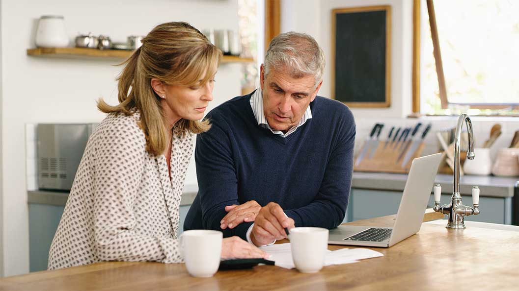 A man and a woman looking at paperwork