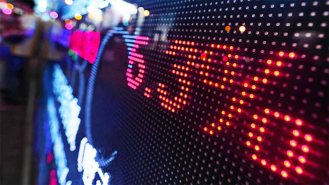 A digital stock market display showing a percentage in red