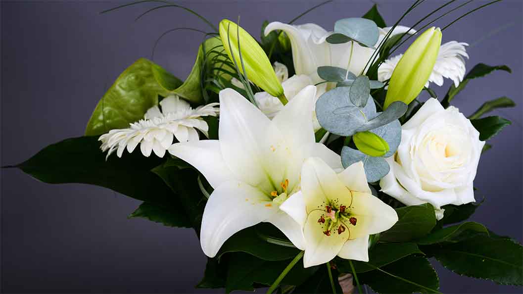 Funeral flower bouquet in white